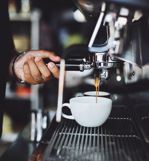 close-up-of-hand-holding-coffee-cup-302902